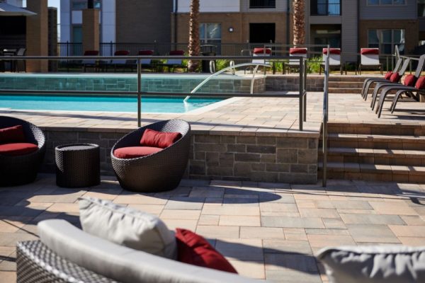 Closeup of the poolside sundeck with lounge chairs and other outdoor furniture